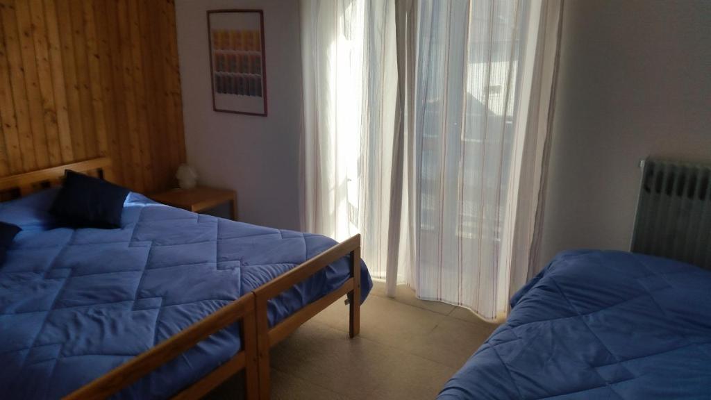 Postel nebo postele na pokoji v ubytování Hotel Tomei