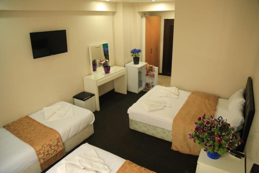 Postel nebo postele na pokoji v ubytování holiday family apart