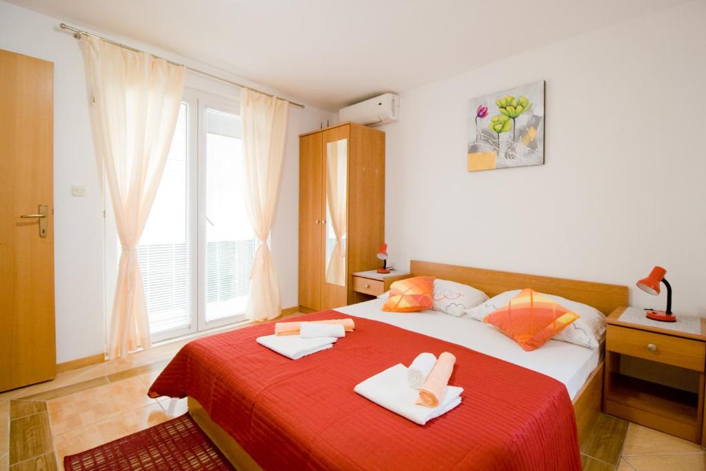 Postel nebo postele na pokoji v ubytování Apartmani Diki