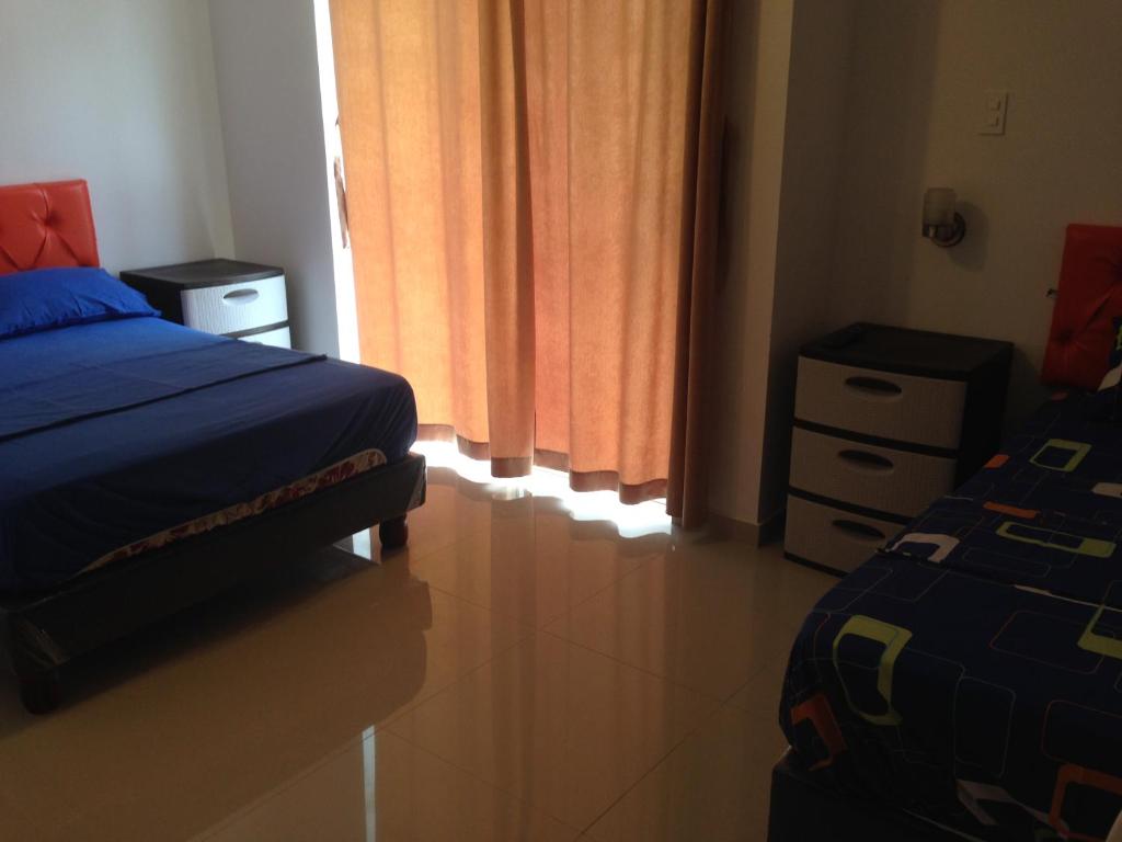 Postel nebo postele na pokoji v ubytování Hotel Almond Beach