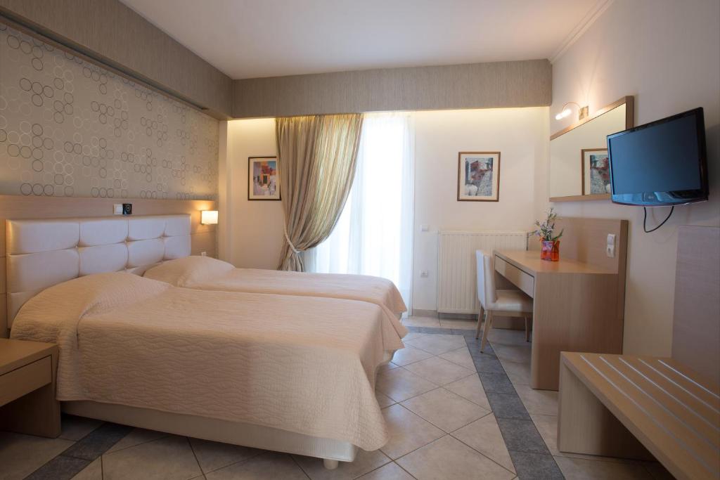 Postel nebo postele na pokoji v ubytování Hotel Philip