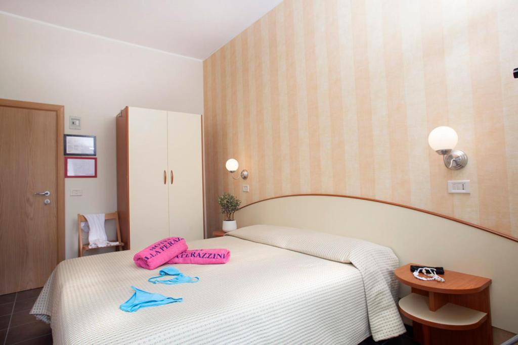 Postel nebo postele na pokoji v ubytování Hotel Villa Perazzini
