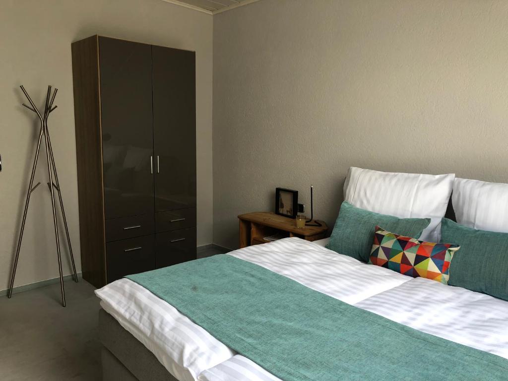 Postel nebo postele na pokoji v ubytování Fi-Suiten