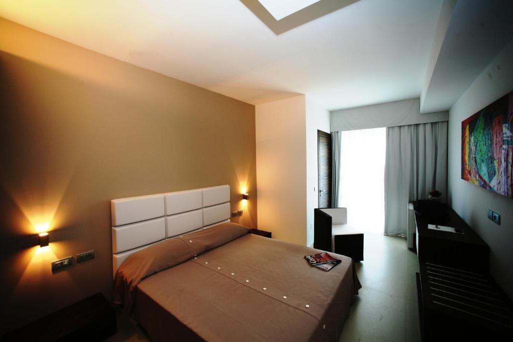 Postel nebo postele na pokoji v ubytování White Hotel