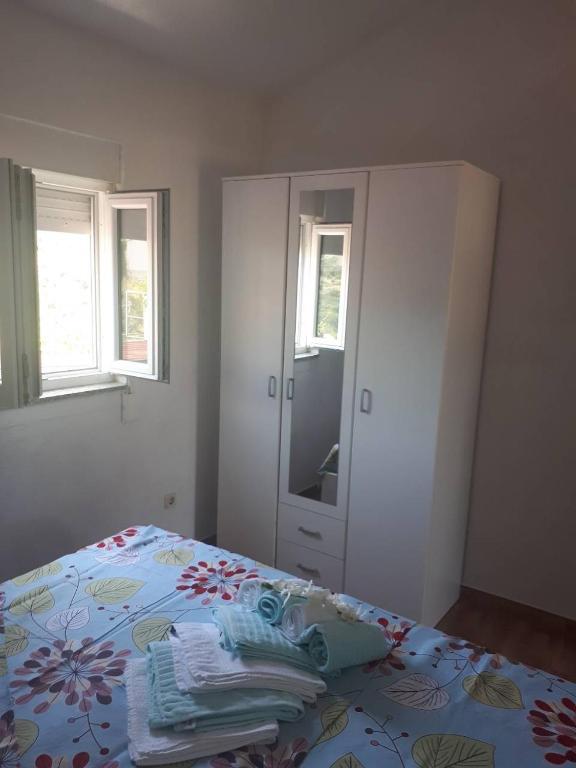 Postel nebo postele na pokoji v ubytování Apartments Ante-Gojko