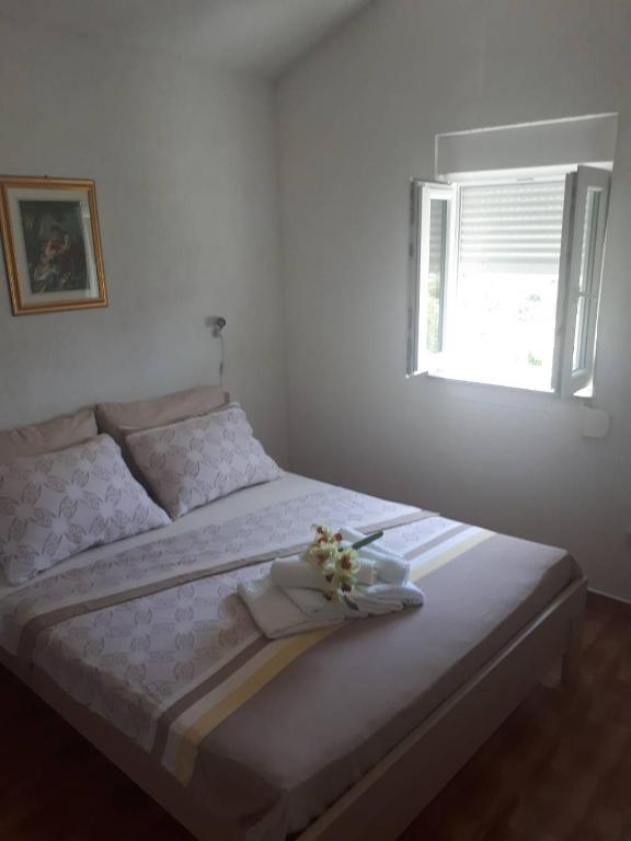 Postel nebo postele na pokoji v ubytování Apartments Ante-Gojko