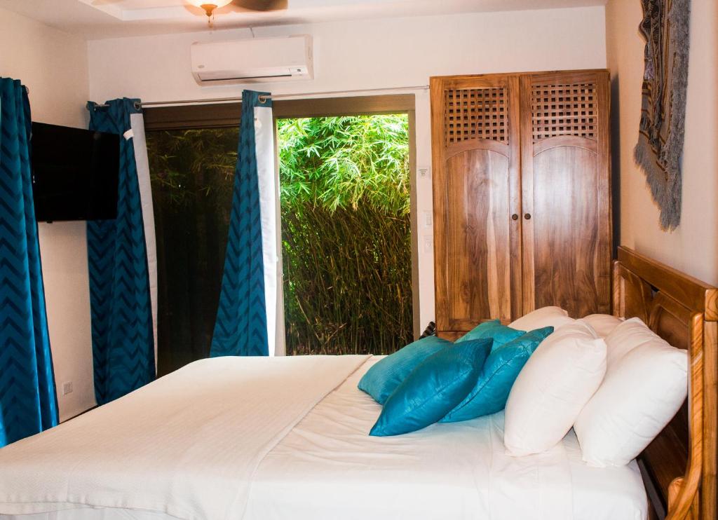 Postel nebo postele na pokoji v ubytování Hotel-Boutique Patampa