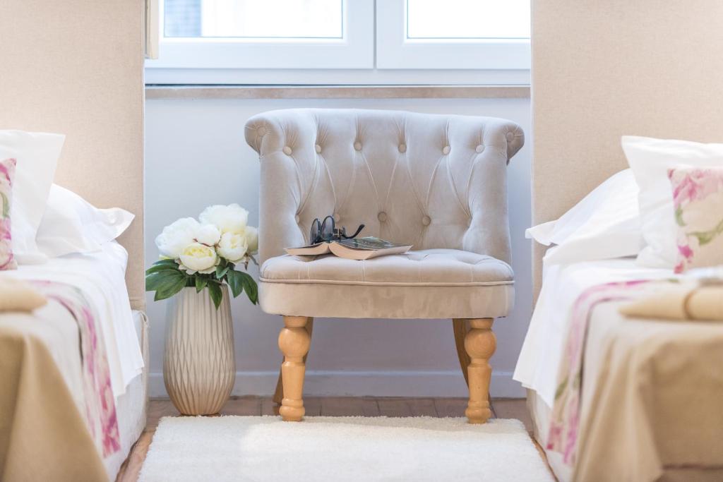 Un ou plusieurs lits dans un hébergement de l'établissement Guest House Flores