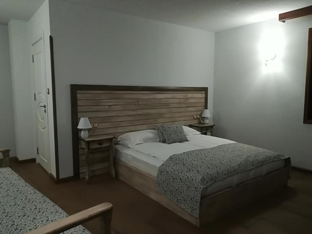 Postel nebo postele na pokoji v ubytování Manoleva House