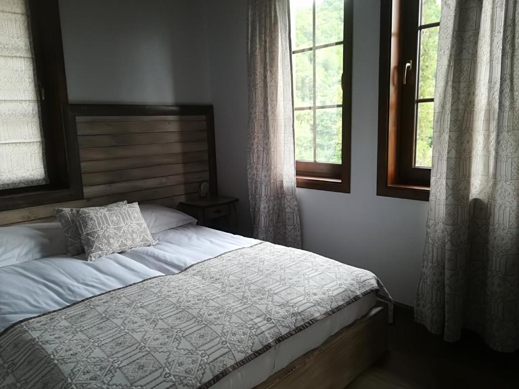Postel nebo postele na pokoji v ubytování Manoleva House