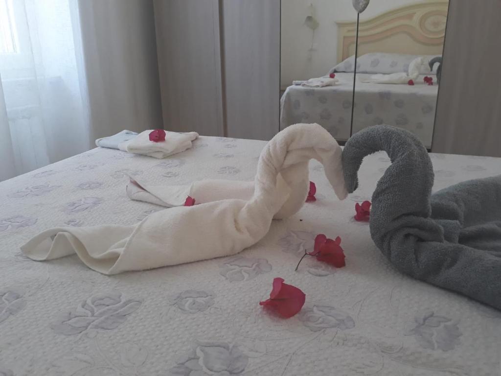 a bed with two swans made to look like hearts at Casa Rinuccia in Ischia