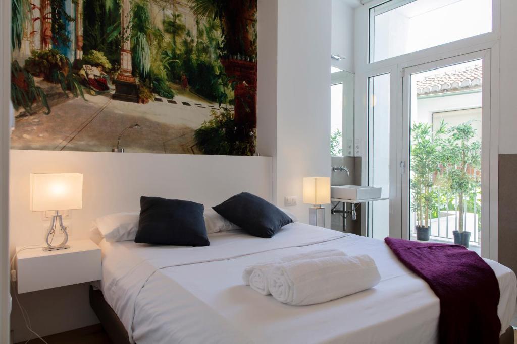 Postel nebo postele na pokoji v ubytování FLORIT FLATS - Serranos Apartment