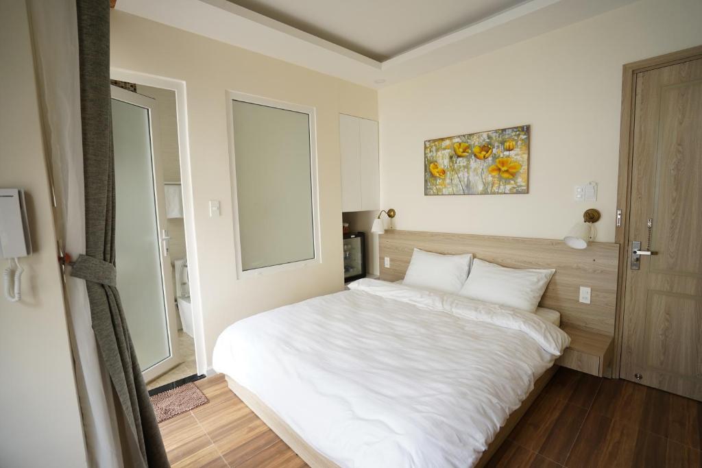 Postel nebo postele na pokoji v ubytování Homeland Hotel