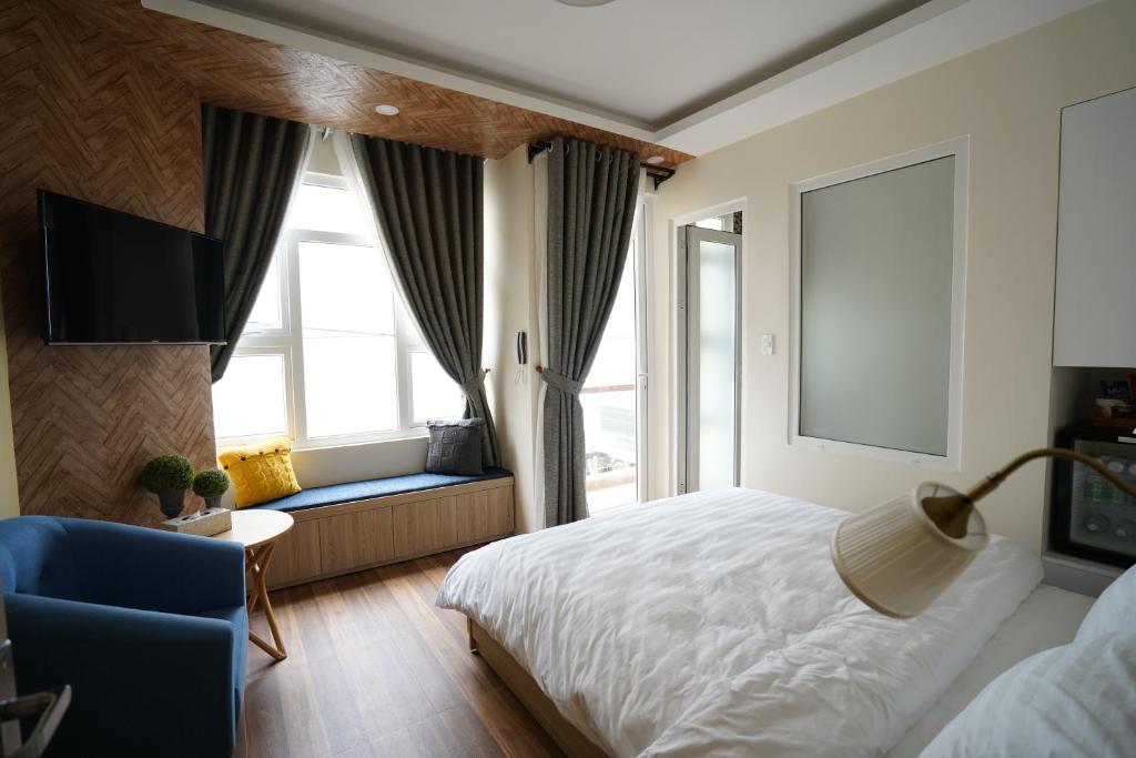 Ένα ή περισσότερα κρεβάτια σε δωμάτιο στο Homeland Hotel