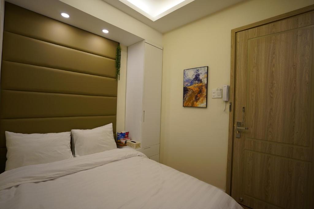 Postel nebo postele na pokoji v ubytování Homeland Hotel