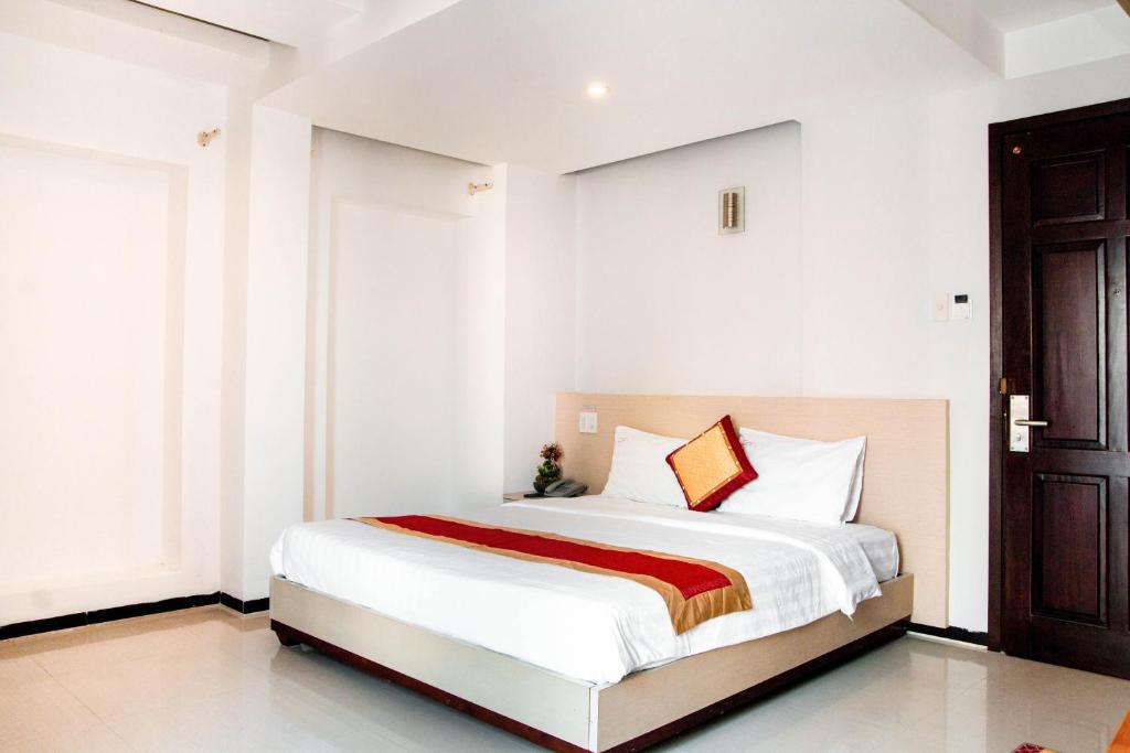 Postel nebo postele na pokoji v ubytování Le Duong Hotel