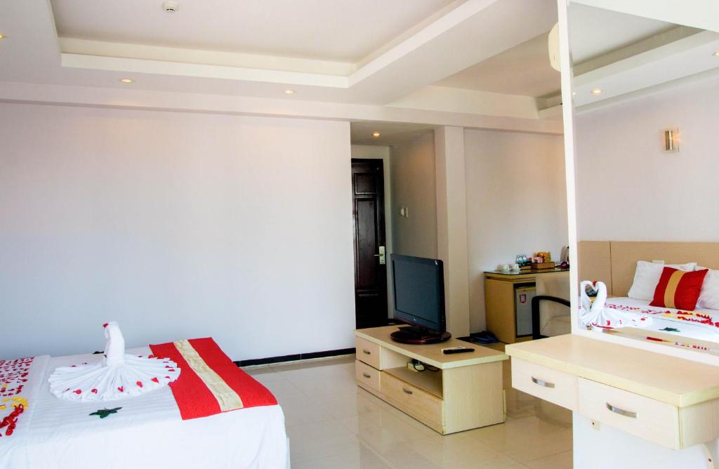 Postel nebo postele na pokoji v ubytování Le Duong Hotel