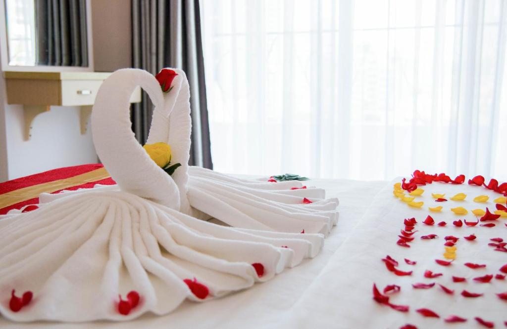 Postel nebo postele na pokoji v ubytování Le Duong Hotel