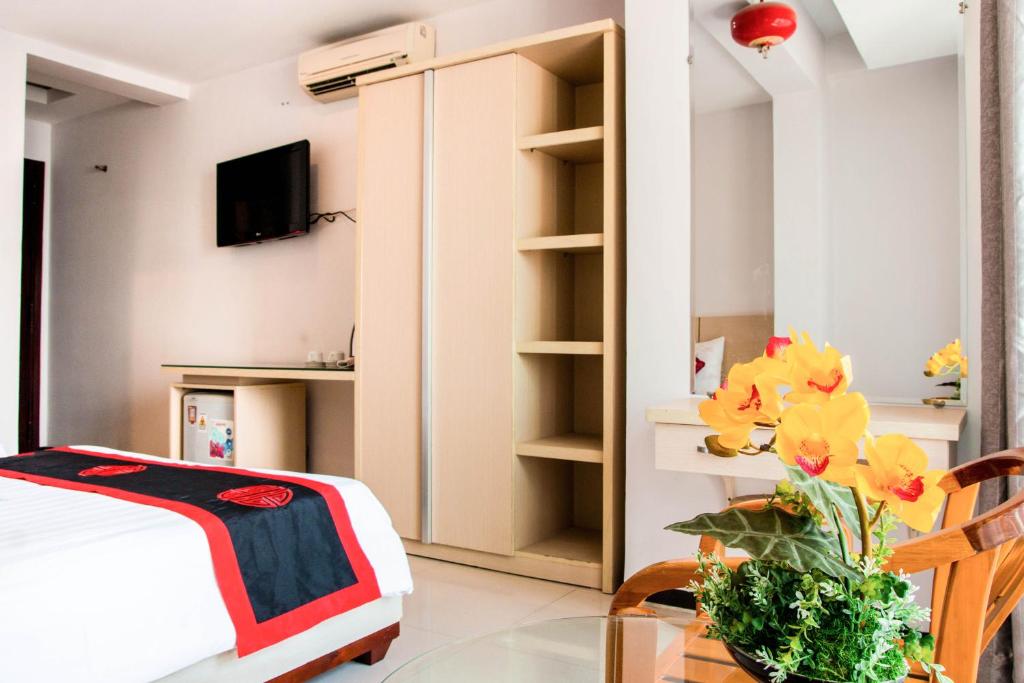 Postel nebo postele na pokoji v ubytování Le Duong Hotel