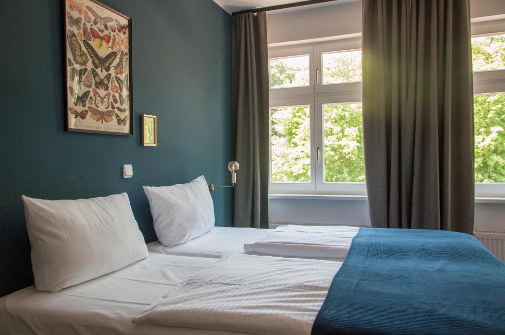Postel nebo postele na pokoji v ubytování Lieblingsplatz Bohlendorf Rügen
