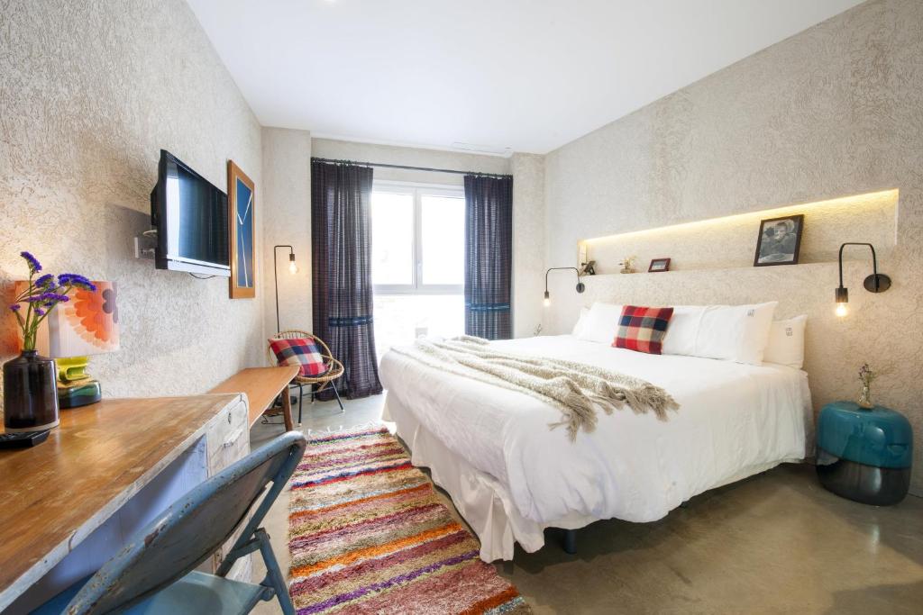Postel nebo postele na pokoji v ubytování Kook Hotel Tarifa