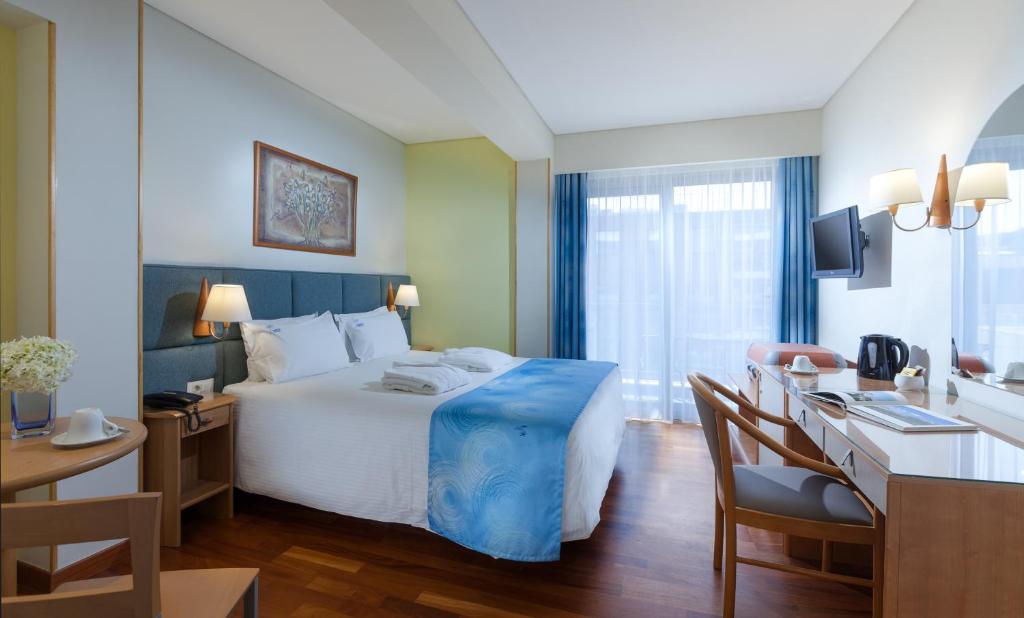 Postel nebo postele na pokoji v ubytování Tropical Hotel