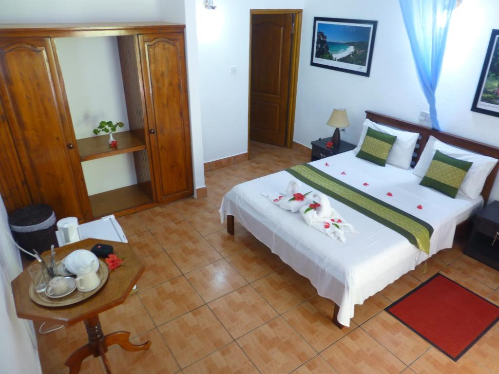 Postel nebo postele na pokoji v ubytování Zerof Guest House