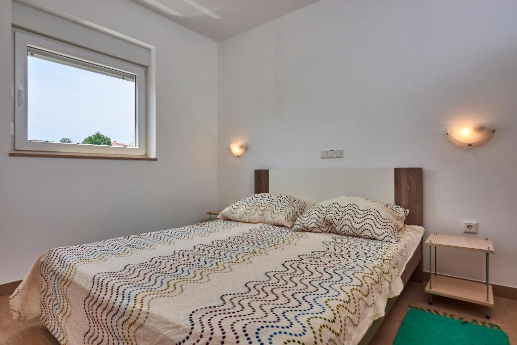 Postel nebo postele na pokoji v ubytování Apartmani B&B