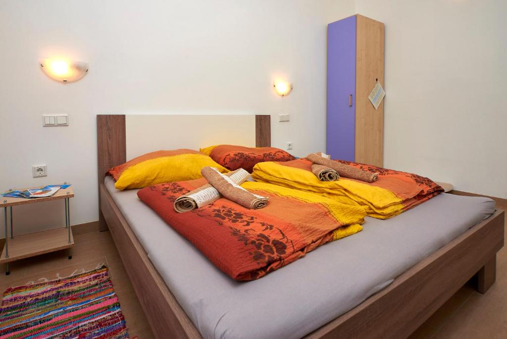 Postel nebo postele na pokoji v ubytování Apartmani B&B