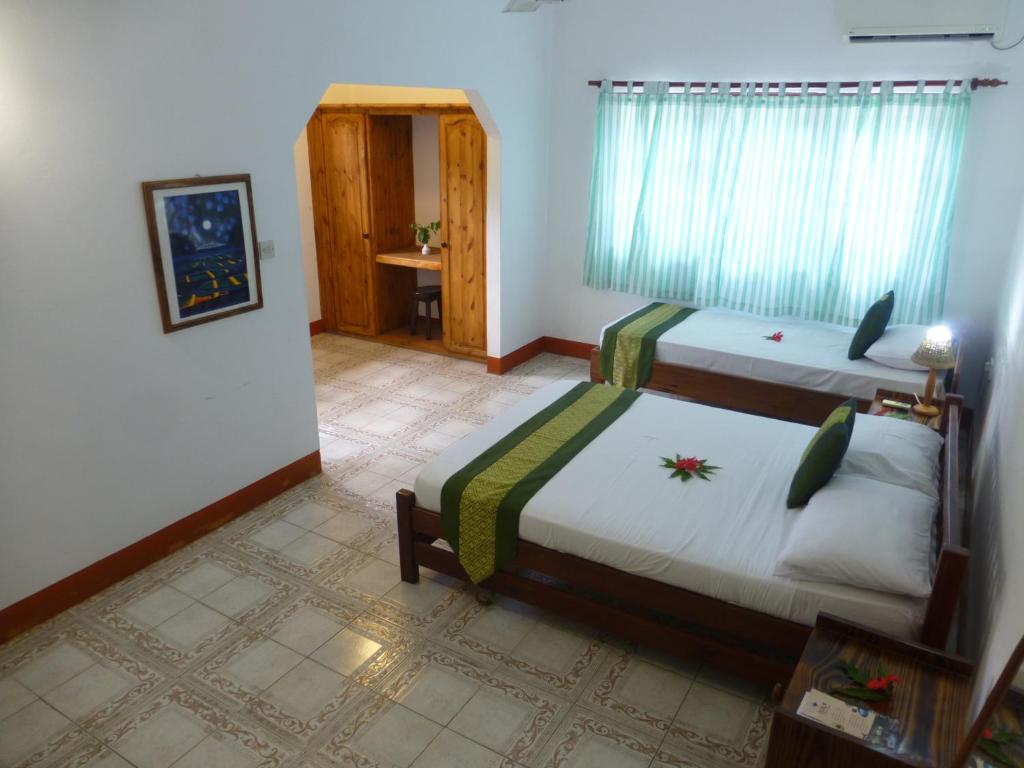 Postel nebo postele na pokoji v ubytování Zerof Guest House