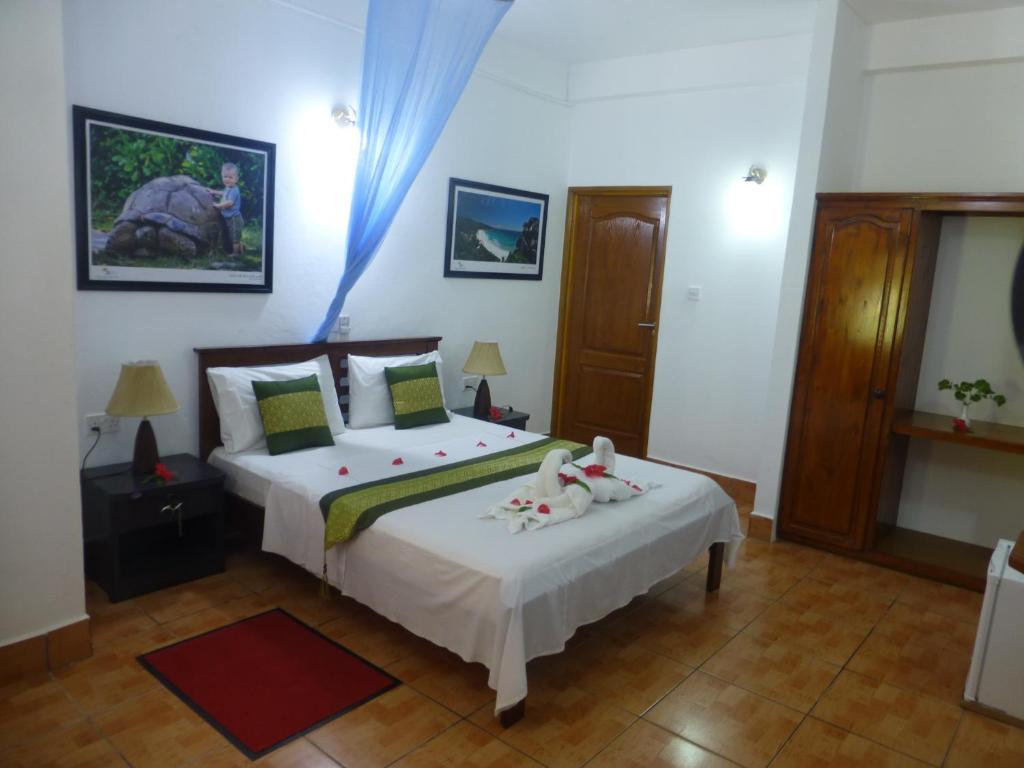 Postel nebo postele na pokoji v ubytování Zerof Guest House