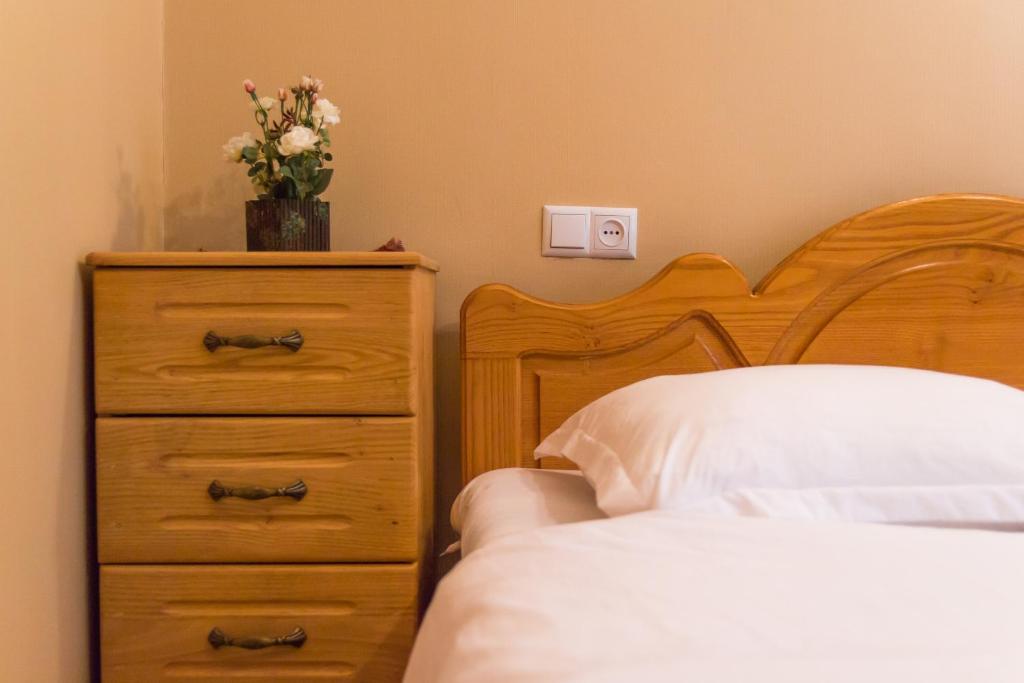 Postel nebo postele na pokoji v ubytování Hotel Magdalena