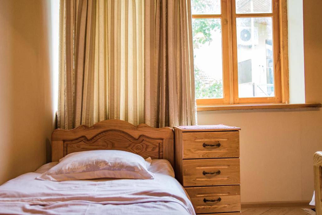 Postel nebo postele na pokoji v ubytování Hotel Magdalena