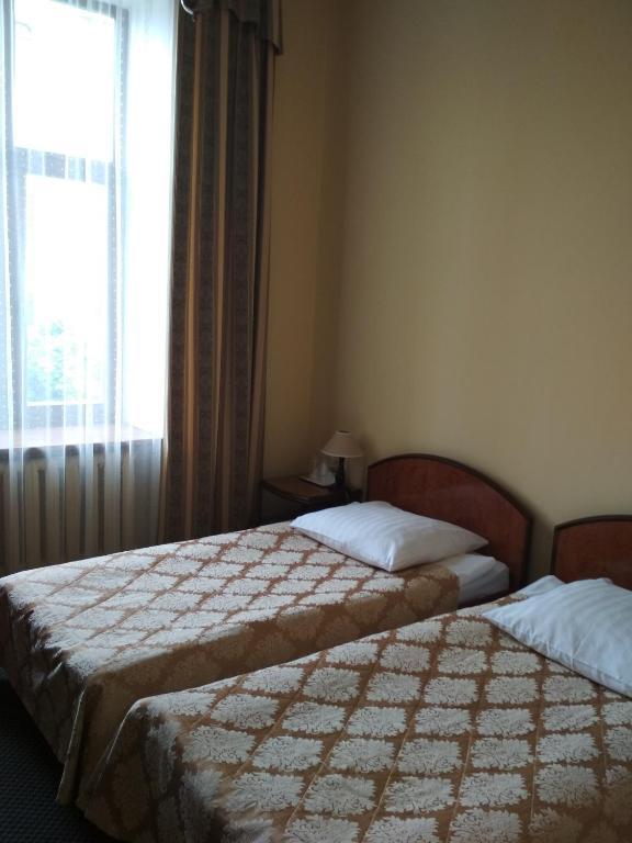 Postel nebo postele na pokoji v ubytování Wien Hotel