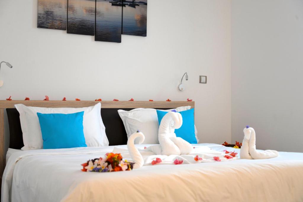 Postel nebo postele na pokoji v ubytování Toparadis Guest House