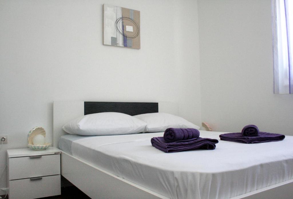 Postel nebo postele na pokoji v ubytování Apartment MEL II