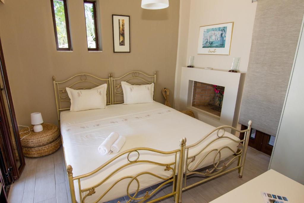 Postel nebo postele na pokoji v ubytování Tajo VIllas