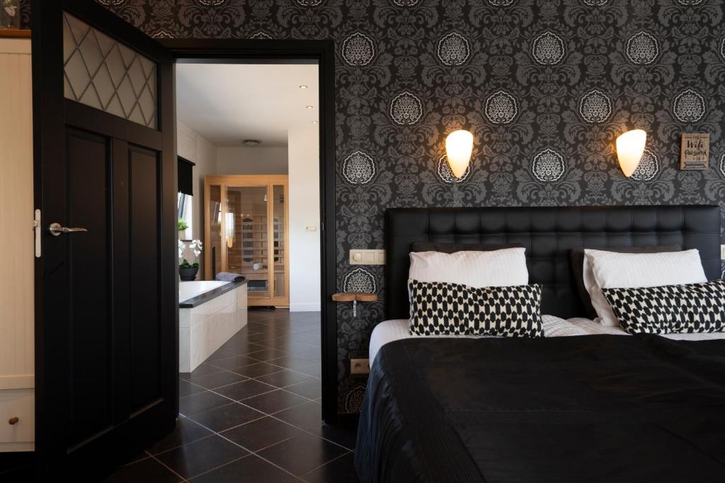 Postel nebo postele na pokoji v ubytování B&B Montenakerhof