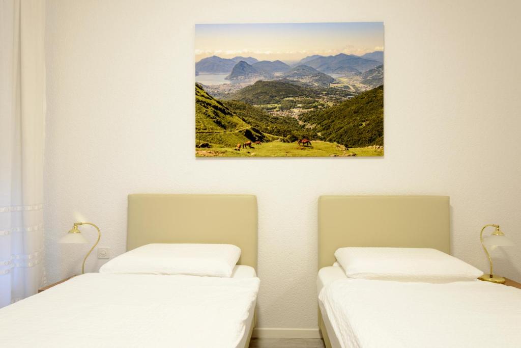 Ein Bett oder Betten in einem Zimmer der Unterkunft Hotel Ceresio