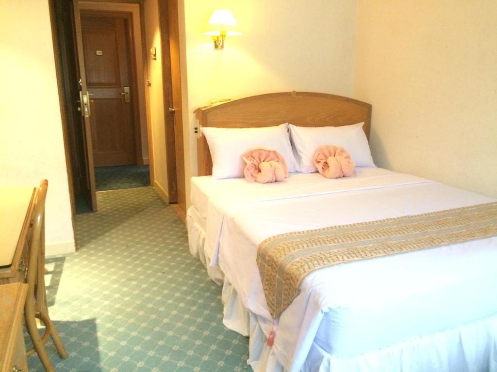 Postel nebo postele na pokoji v ubytování Terrace Hotel