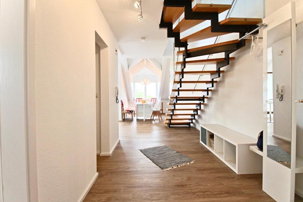 a hallway with a spiral staircase in a house at Maisonette Alpenblick in Überlingen