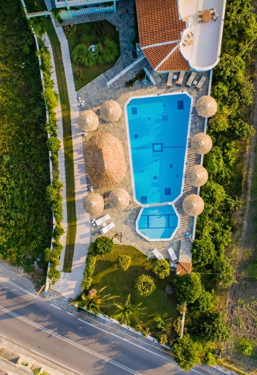 an overhead view of a swimming pool at a resort at Kokkari Beach Hotel in Kokkari