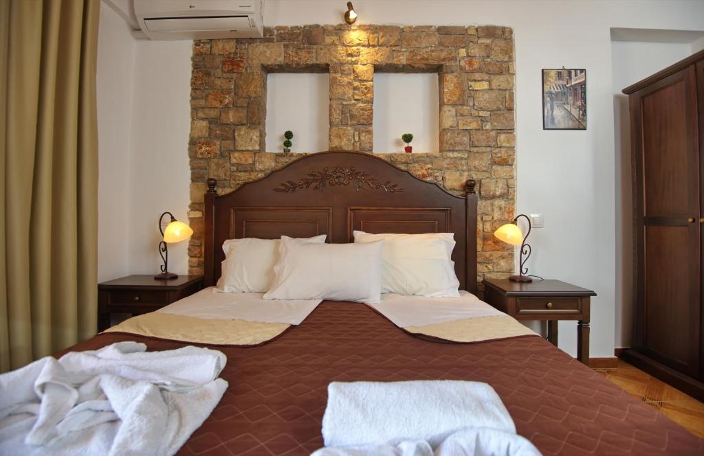 Postel nebo postele na pokoji v ubytování Marilena Apartments