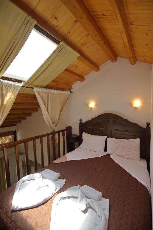 Postel nebo postele na pokoji v ubytování Marilena Apartments