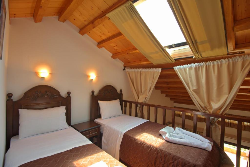 Postel nebo postele na pokoji v ubytování Marilena Apartments