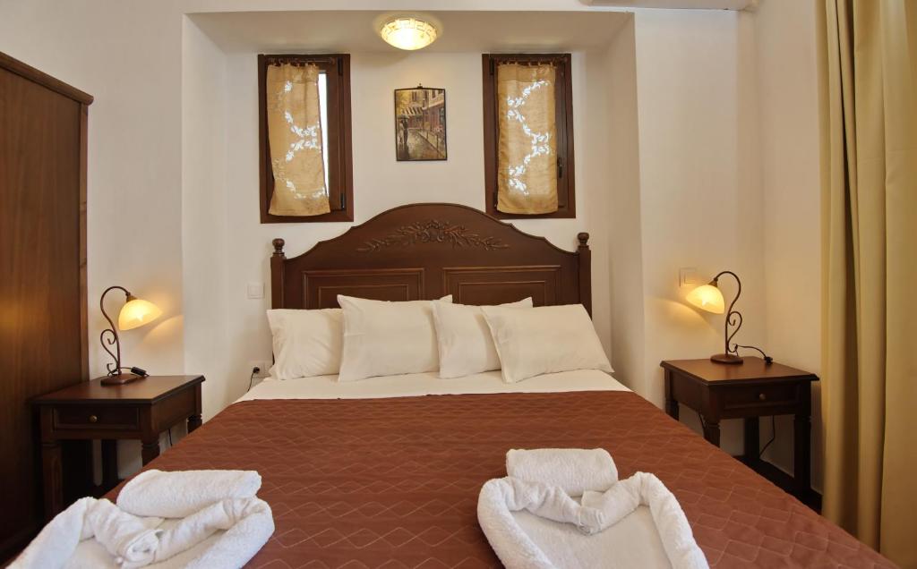 Postel nebo postele na pokoji v ubytování Marilena Apartments