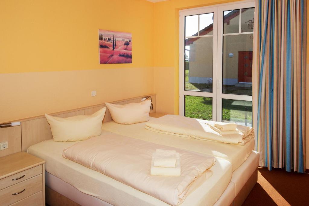 Postel nebo postele na pokoji v ubytování Seepark Auenhain