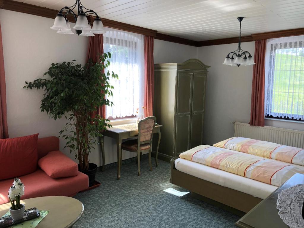 Postel nebo postele na pokoji v ubytování Pension Bennelliebschänke