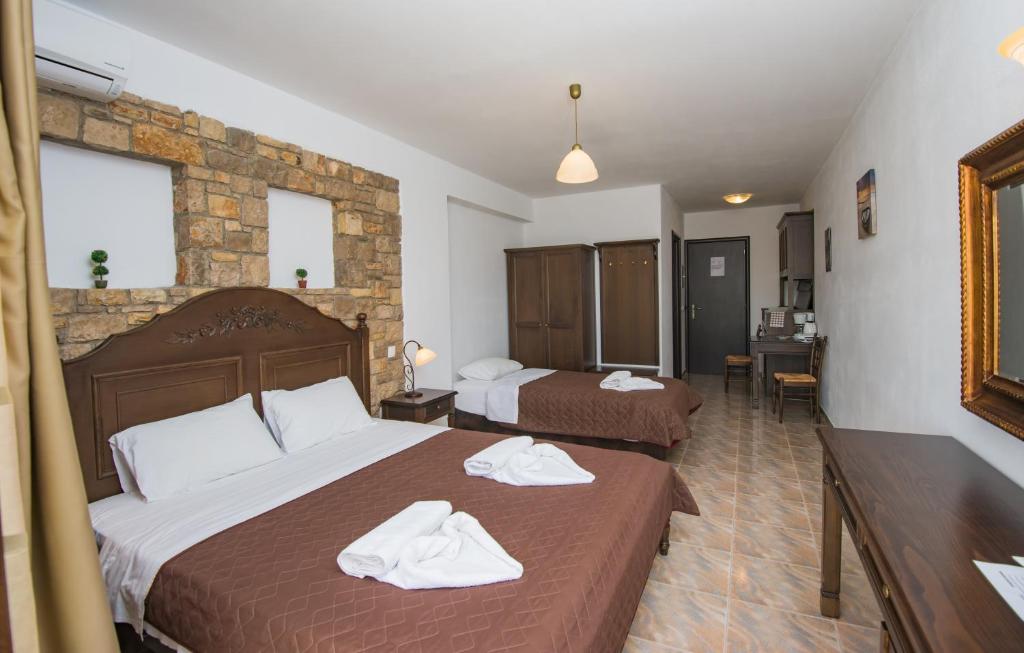 Postel nebo postele na pokoji v ubytování Marilena Apartments