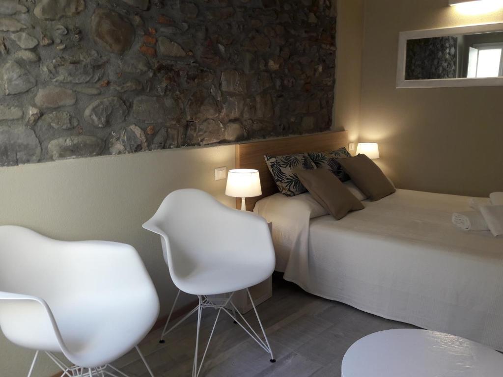 Łóżko lub łóżka w pokoju w obiekcie Santa Marta Rooms - Vernazza